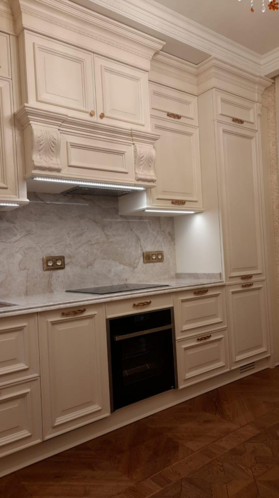 Medium sized classic single-wall kitchen/diner in Moscow with open cabinets, white cabinets, marble worktops, grey splashback, marble splashback, white appliances, medium hardwood flooring, a breakfast bar, brown floors, white worktops and a drop ceiling.