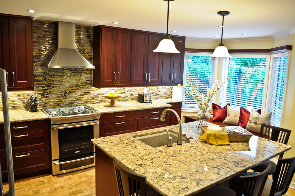 Example of a transitional cork floor kitchen design in Ottawa with recessed-panel cabinets, brown cabinets, quartzite countertops, multicolored backsplash, mosaic tile backsplash, stainless steel appliances and an island