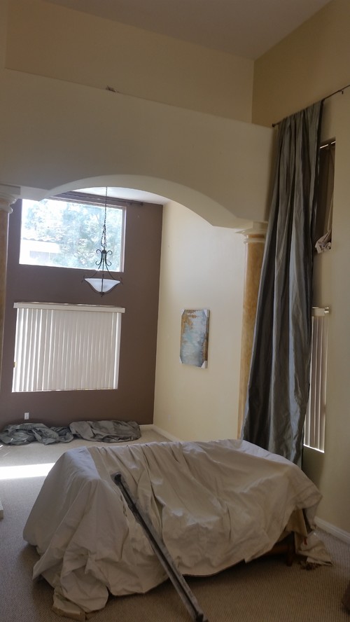 Hanging curtains with high ceilings  at different heights  