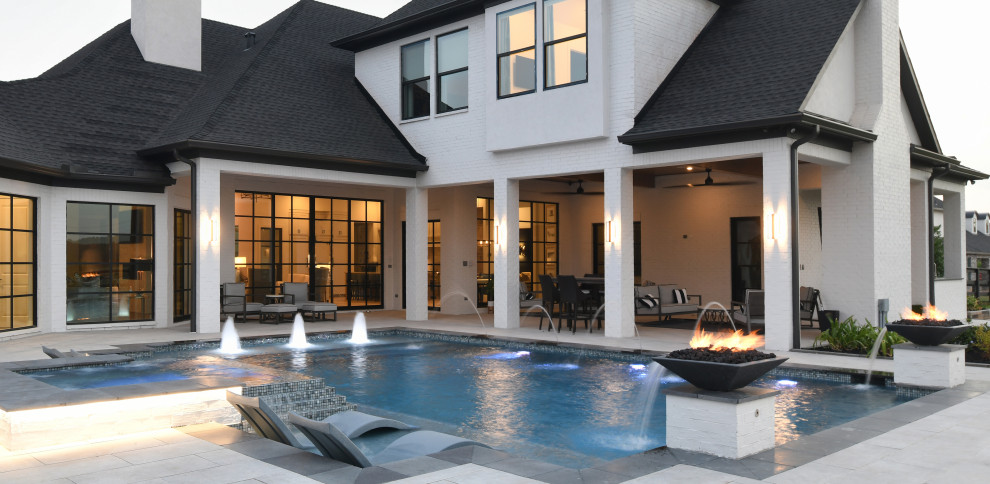 Example of a large transitional home design design in Houston