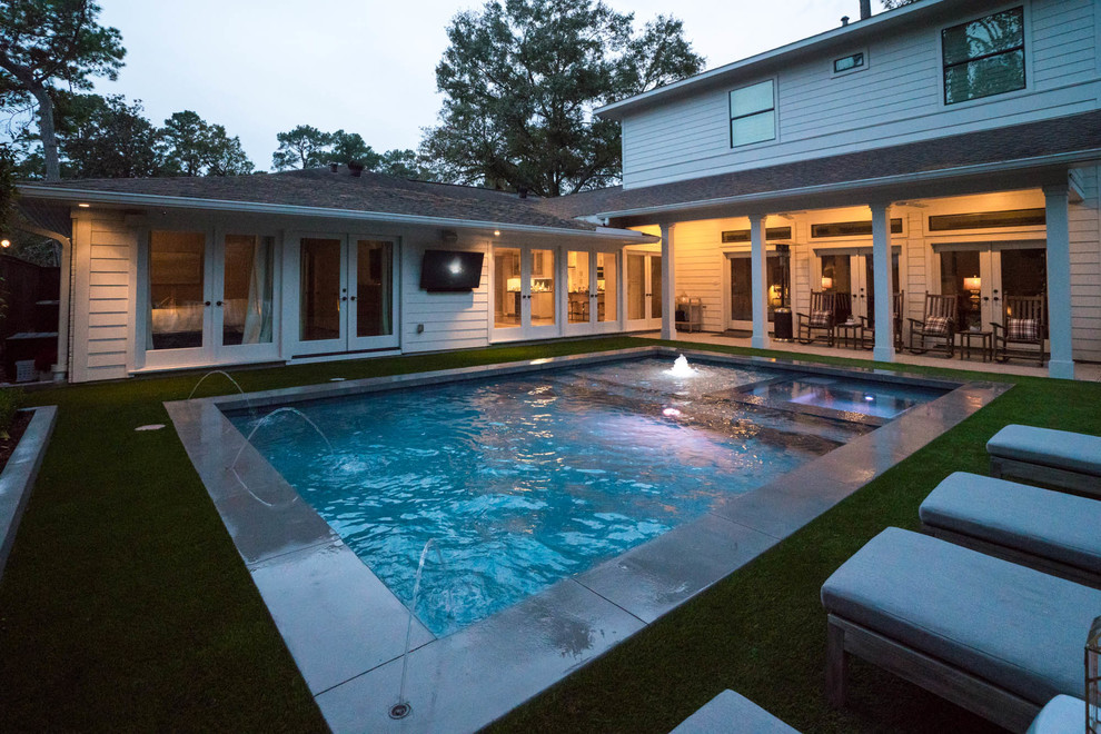 Inspiration for a small contemporary backyard rectangular pool in Houston with decking.