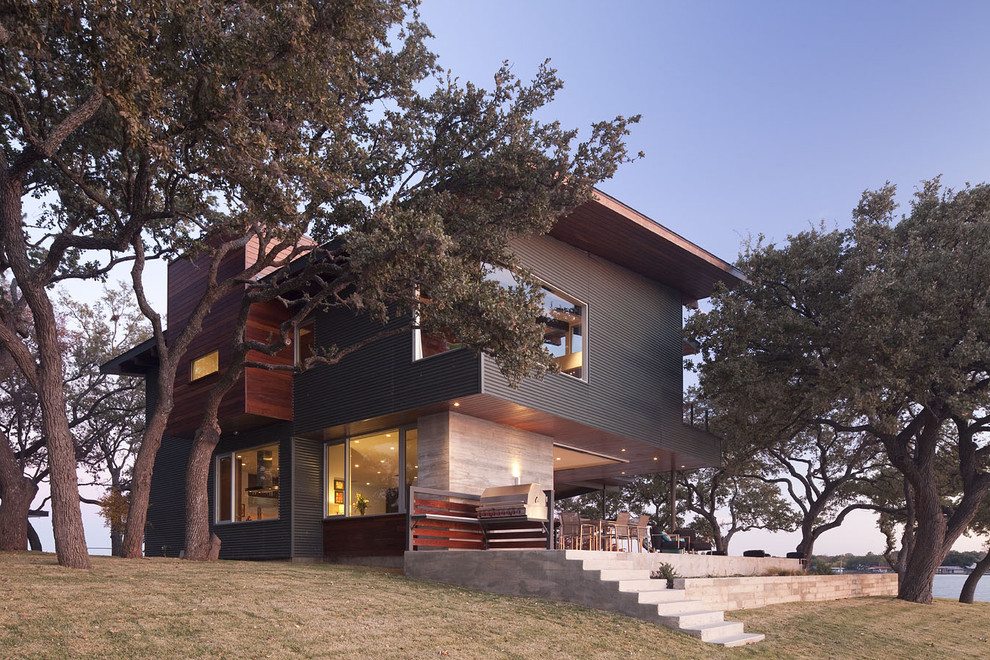 Design ideas for a large contemporary two-storey multi-coloured exterior in Austin with metal siding and a flat roof.
