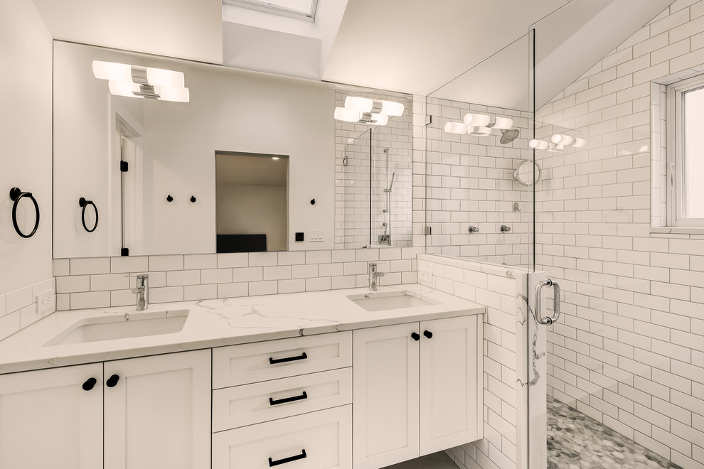 Design ideas for a mid-sized contemporary master bathroom in Seattle with shaker cabinets, white cabinets, a double shower, white tile, ceramic tile, white walls, ceramic floors, an undermount sink, engineered quartz benchtops, white floor, a hinged shower door and white benchtops.