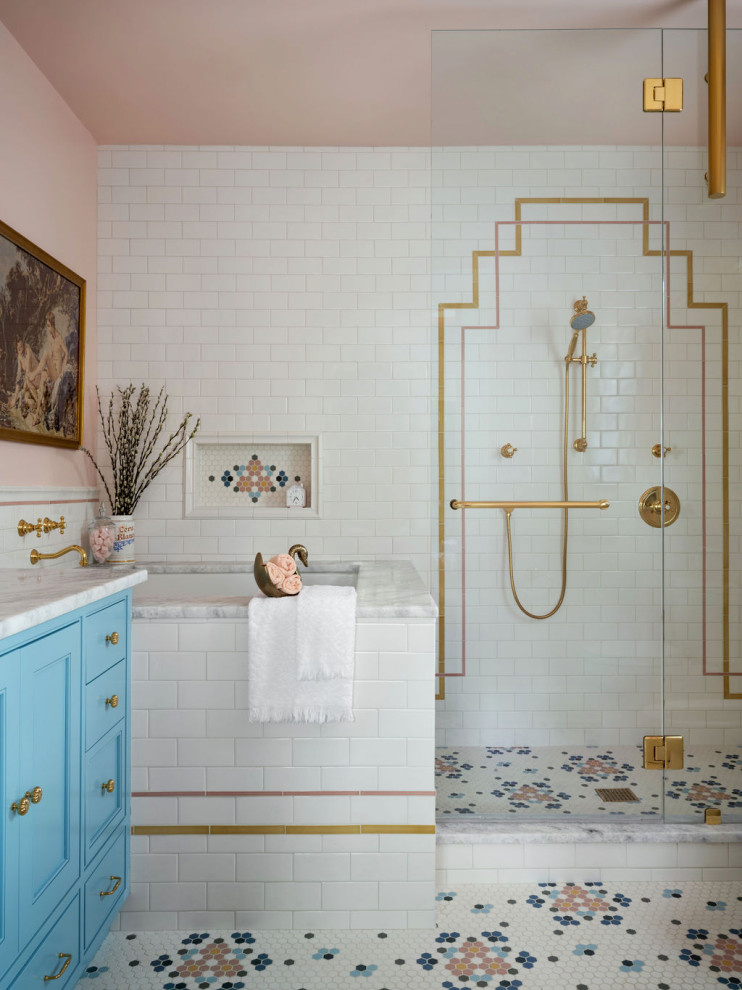 Design ideas for an eclectic bathroom in Atlanta with beaded inset cabinets, blue cabinets, a japanese tub, white tile, subway tile, pink walls, mosaic tile floors, multi-coloured floor, a hinged shower door, white benchtops, a niche and a built-in vanity.
