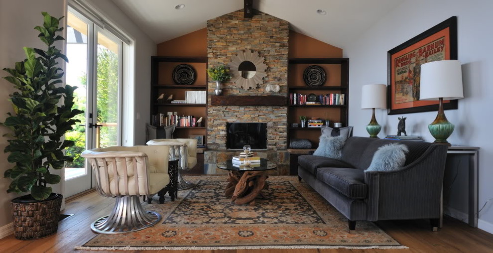Photo of a transitional living room in Los Angeles with a standard fireplace.