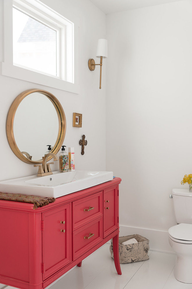 Photo of a mid-sized transitional powder room in Other with furniture-like cabinets, white walls, painted wood floors, wood benchtops, white floor, white tile, a one-piece toilet, red cabinets and a vessel sink.