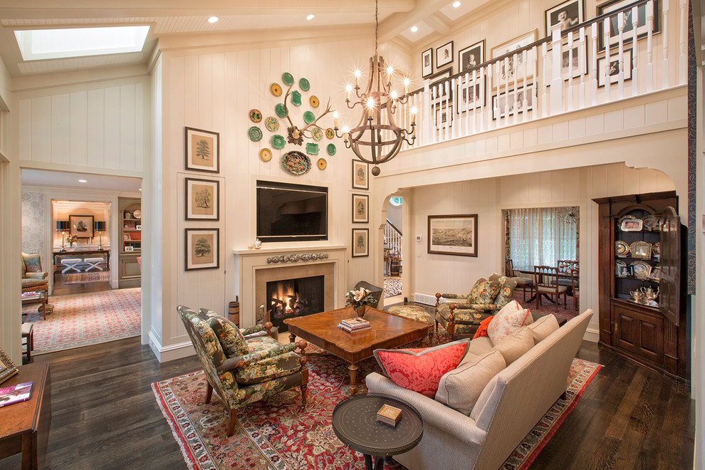 Family room in Omaha with white walls, dark hardwood floors, a standard fireplace and a wall-mounted tv.
