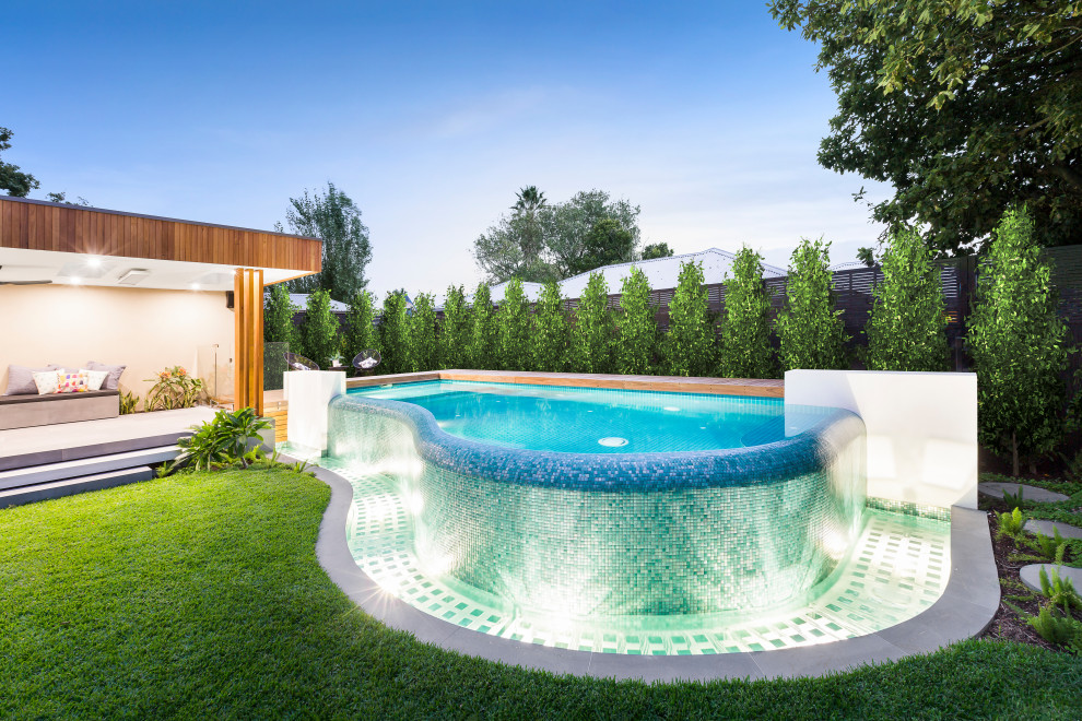 Contemporary custom-shaped aboveground pool in Melbourne.