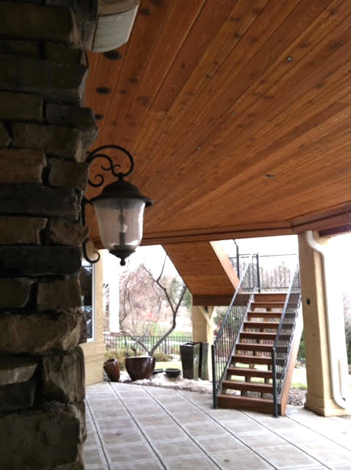Deck - large rustic backyard deck idea in Denver