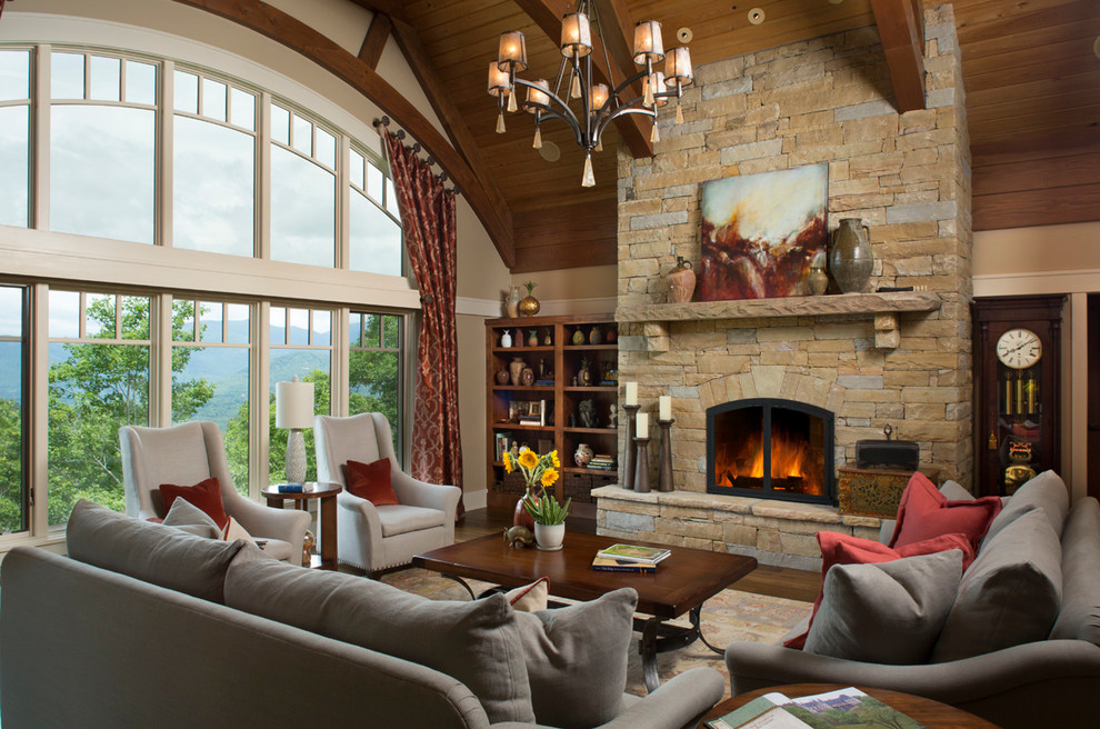 Arts and crafts living room in Other with medium hardwood floors, a standard fireplace and a stone fireplace surround.