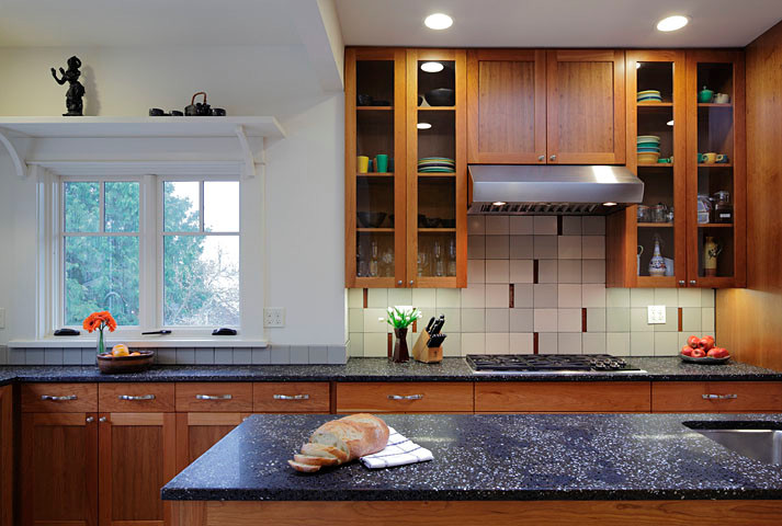 Inspiration for a large transitional eat-in kitchen remodel in Seattle with a drop-in sink, flat-panel cabinets, medium tone wood cabinets, multicolored backsplash, stainless steel appliances and an island