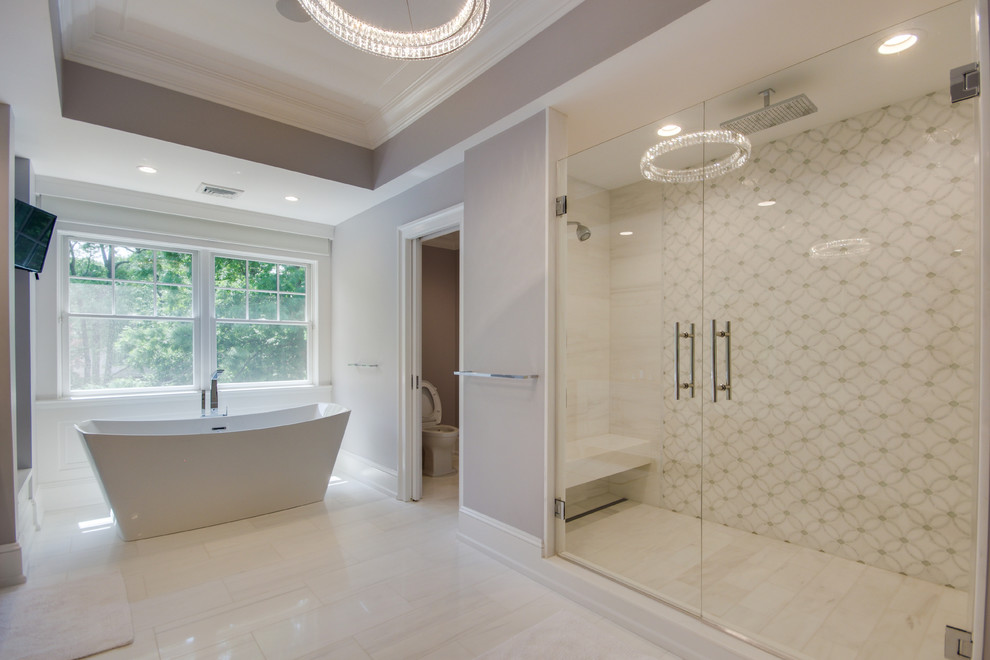 Design ideas for an expansive transitional master bathroom in New York with recessed-panel cabinets, white cabinets, a freestanding tub, an alcove shower, gray tile, white tile, porcelain tile, grey walls, marble floors, an undermount sink, marble benchtops, white floor and a hinged shower door.
