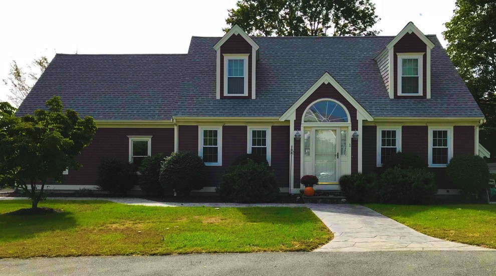 Photo of a mid-sized traditional two-storey purple house exterior in Boston with wood siding, a gable roof and a shingle roof.