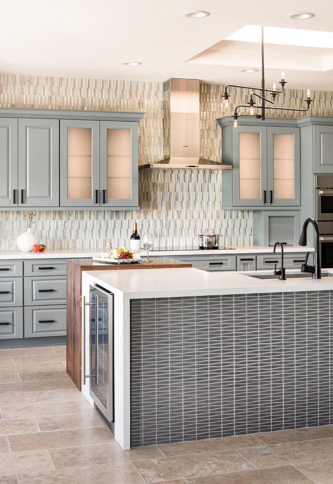 Kitchen - mid-sized transitional l-shaped limestone floor and beige floor kitchen idea in Phoenix with a single-bowl sink, gray cabinets, quartz countertops, glass tile backsplash, stainless steel appliances, an island and white countertops