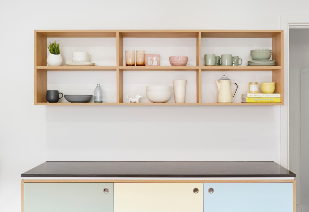 Inspiration for a large scandinavian galley kitchen pantry in Melbourne with a drop-in sink, beaded inset cabinets, medium wood cabinets, concrete benchtops, white splashback, subway tile splashback, stainless steel appliances, cork floors and with island.