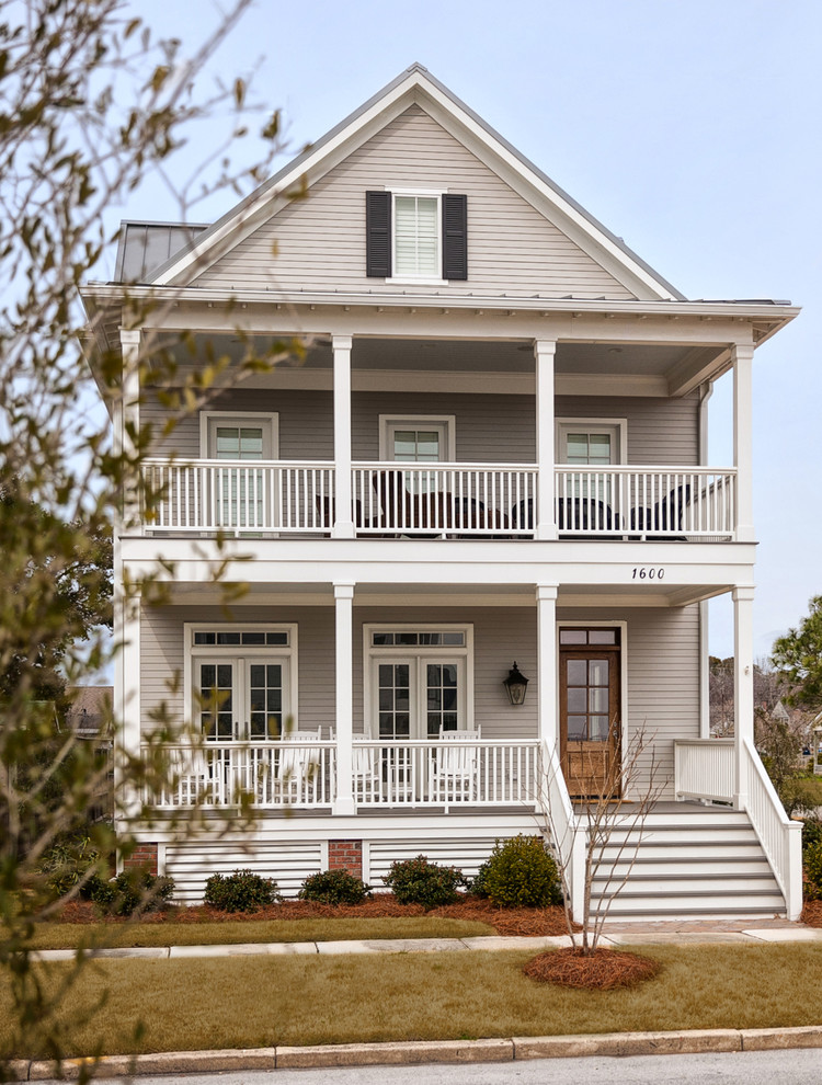 Photo of a traditional two-storey grey exterior in Raleigh.