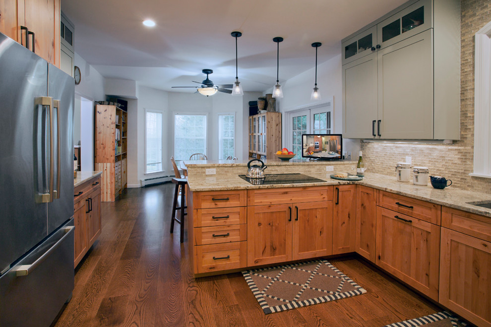 Eat-in kitchen - mid-sized transitional u-shaped medium tone wood floor eat-in kitchen idea with shaker cabinets, stainless steel appliances, a peninsula, an undermount sink, medium tone wood cabinets, granite countertops, beige backsplash and matchstick tile backsplash