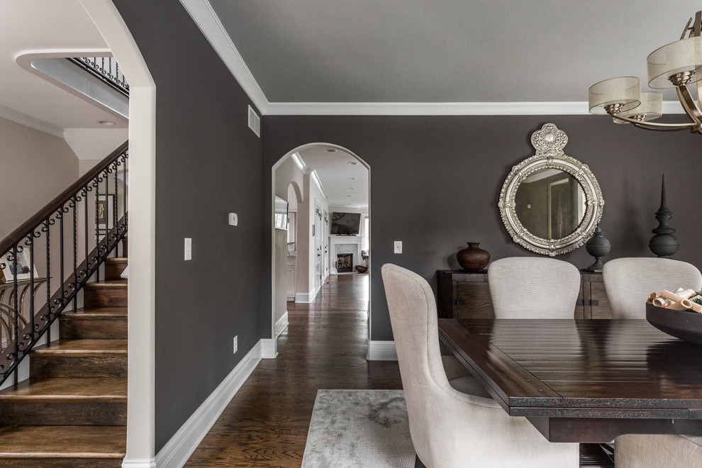 Photo of a mid-sized transitional separate dining room in Indianapolis with grey walls and medium hardwood floors.