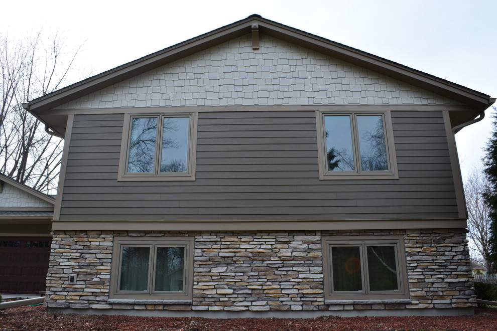 Photo of an arts and crafts exterior in Minneapolis with concrete fiberboard siding.