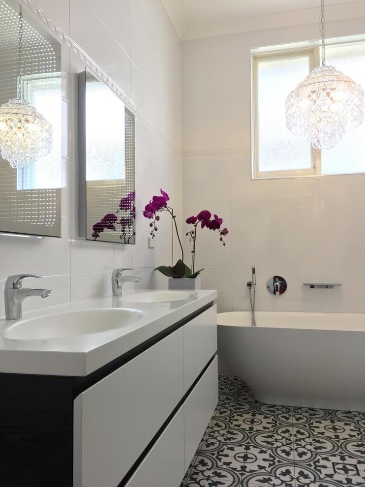 Contemporary bathroom in Sydney with black and white tile, ceramic tile and porcelain floors.