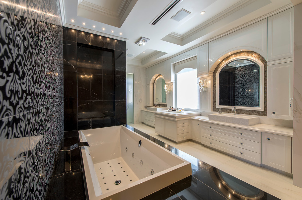 Photo of an expansive transitional master bathroom in Perth with a vessel sink, beaded inset cabinets, white cabinets, engineered quartz benchtops, a drop-in tub, a double shower, white tile, ceramic tile, white walls and ceramic floors.