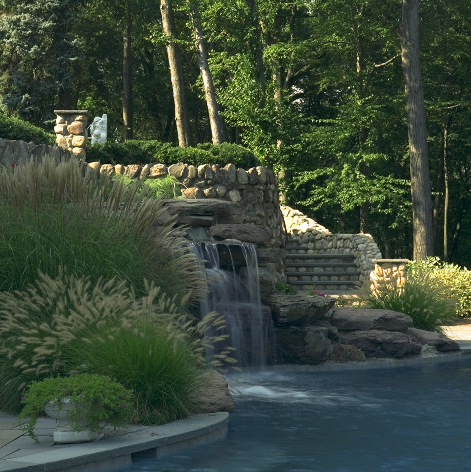 Design ideas for a mid-sized traditional backyard rectangular lap pool in New York with a hot tub and concrete pavers.
