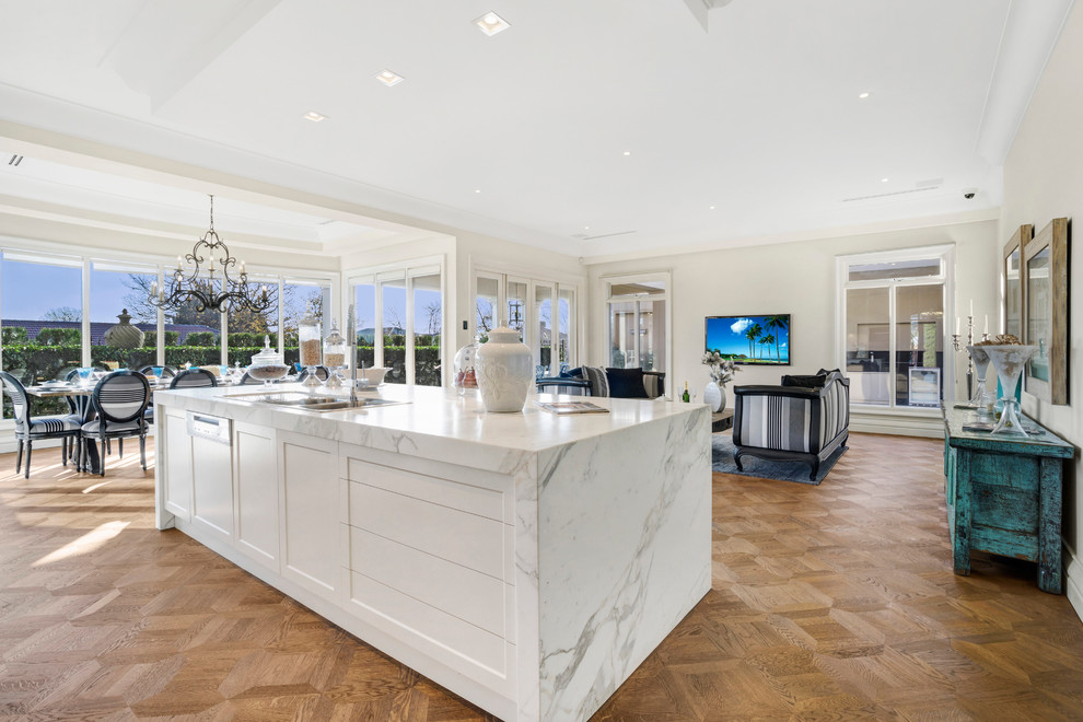 Large mediterranean galley kitchen pantry in Melbourne with a drop-in sink, open cabinets, marble benchtops, mosaic tile splashback, stainless steel appliances, dark hardwood floors and with island.
