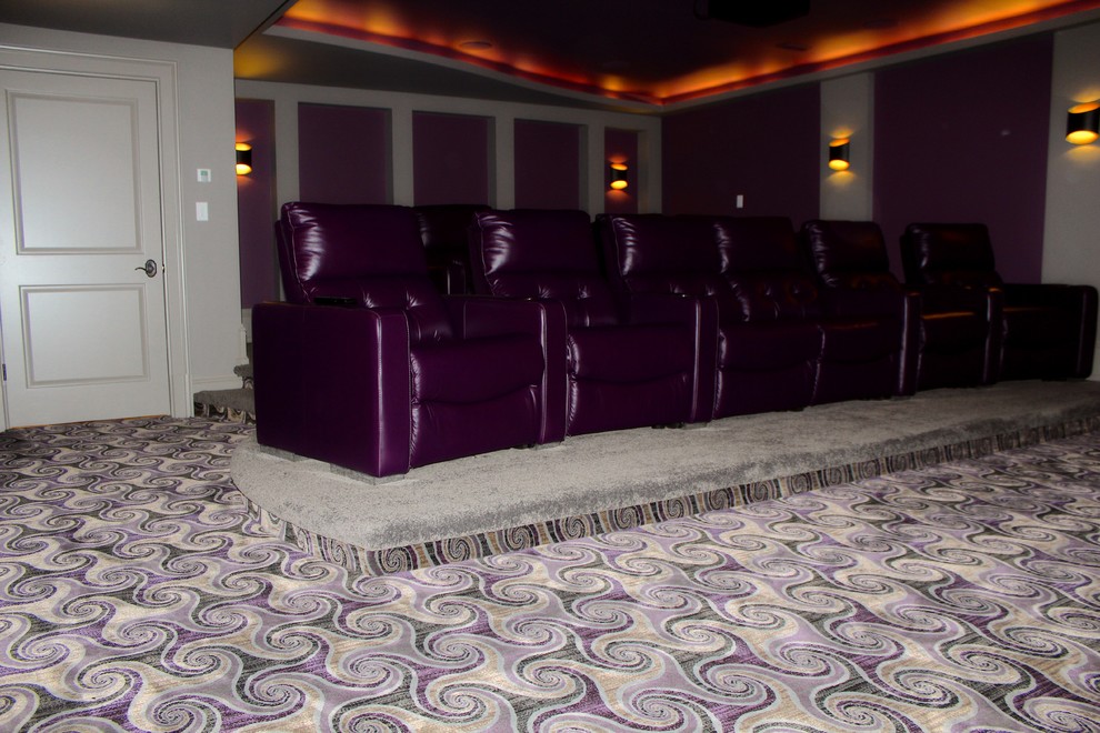 This is an example of a mid-sized traditional enclosed home theatre in Toronto with purple walls and carpet.