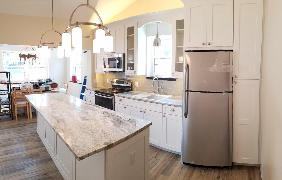 Example of a mid-sized transitional kitchen design in Miami