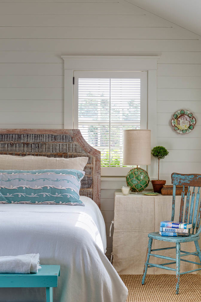 Small beach style master light wood floor bedroom photo in Boston with white walls and no fireplace