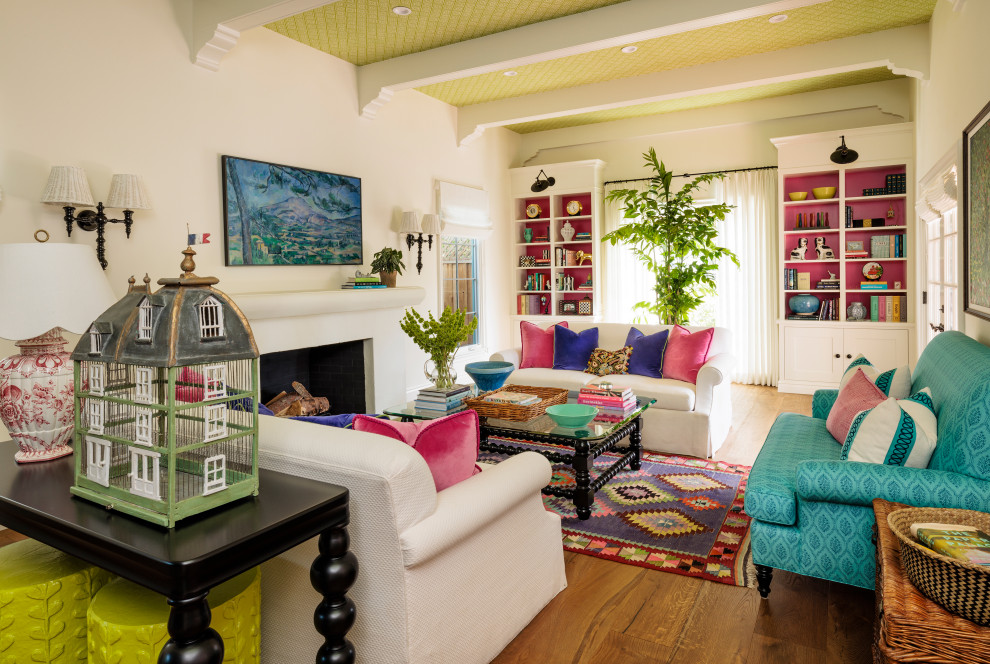 Large bohemian formal living room in Los Angeles with ceramic flooring, a standard fireplace, a wall mounted tv, green floors and a wallpapered ceiling.