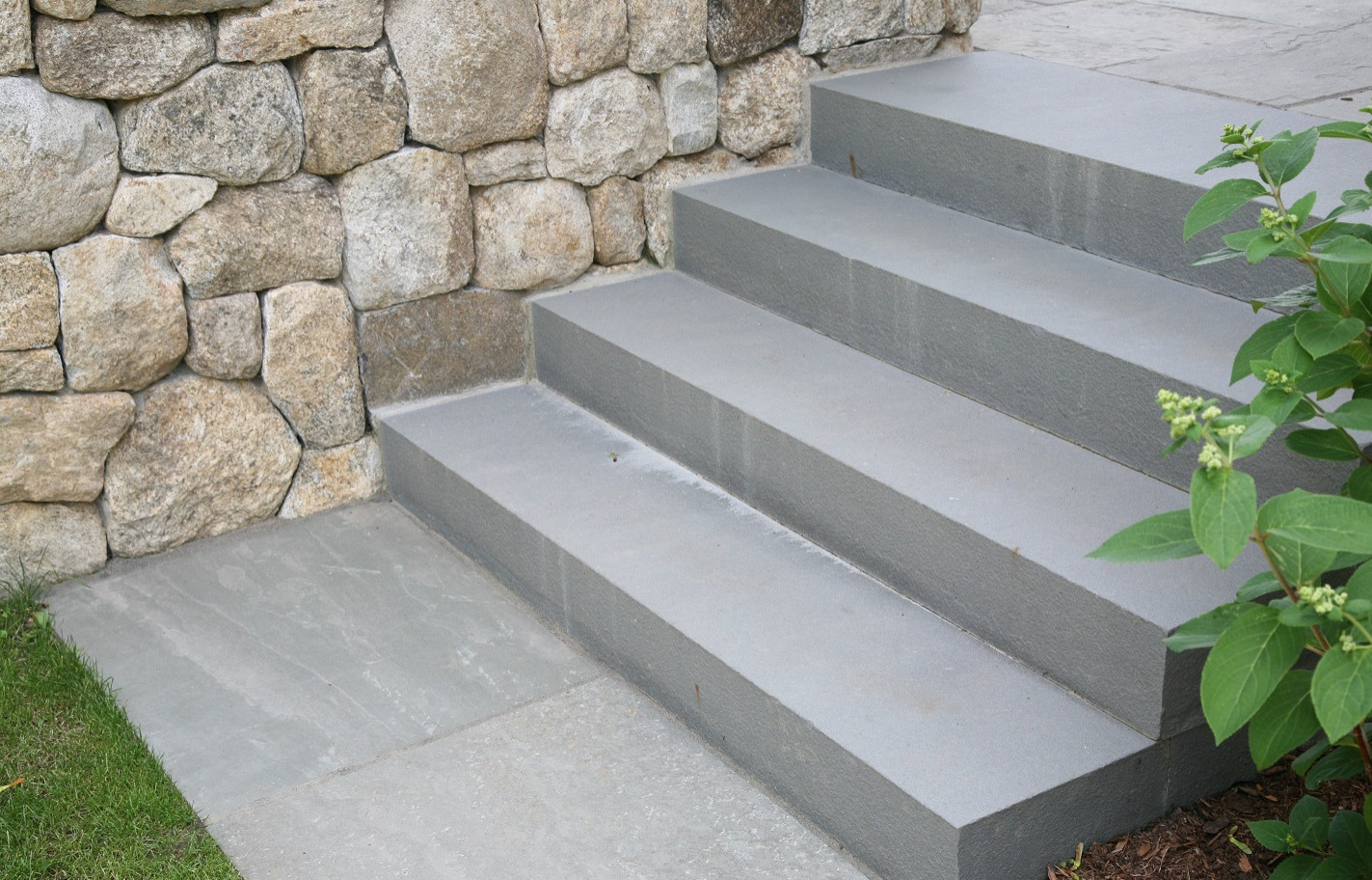 Enduring materials of solid bluestone steps and fieldstone foundation