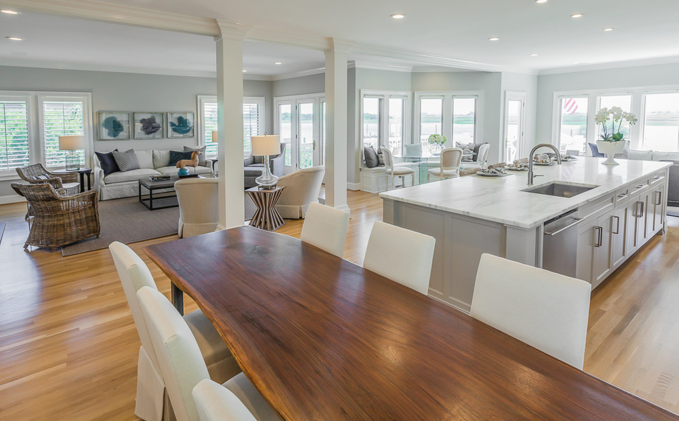 Design ideas for a large transitional open plan dining in Wilmington with grey walls and light hardwood floors.