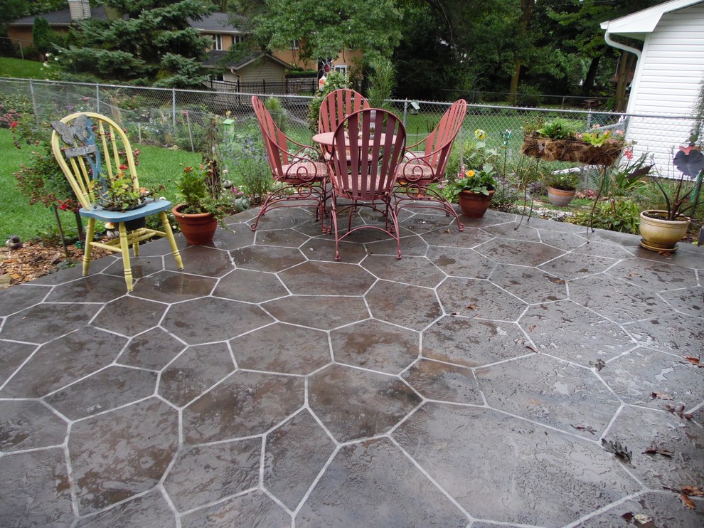 Photo of a small traditional backyard patio in Other with a container garden, tile and no cover.
