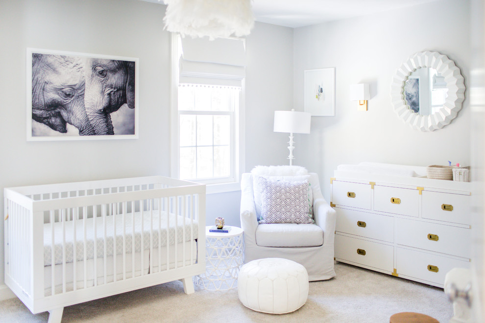This is an example of a mid-sized transitional nursery for girls in Boston with grey walls, carpet and grey floor.