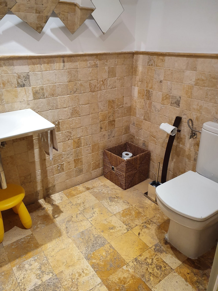 Photo of a mid-sized contemporary kids bathroom in London with a one-piece toilet, beige tile, travertine, beige walls, limestone floors, an undermount sink, beige floor, white benchtops, a single vanity, a freestanding vanity and coffered.