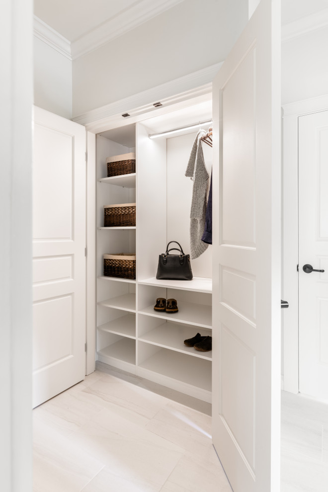 Example of a mid-sized transitional porcelain tile and white floor mudroom design in Vancouver with white walls and a white front door