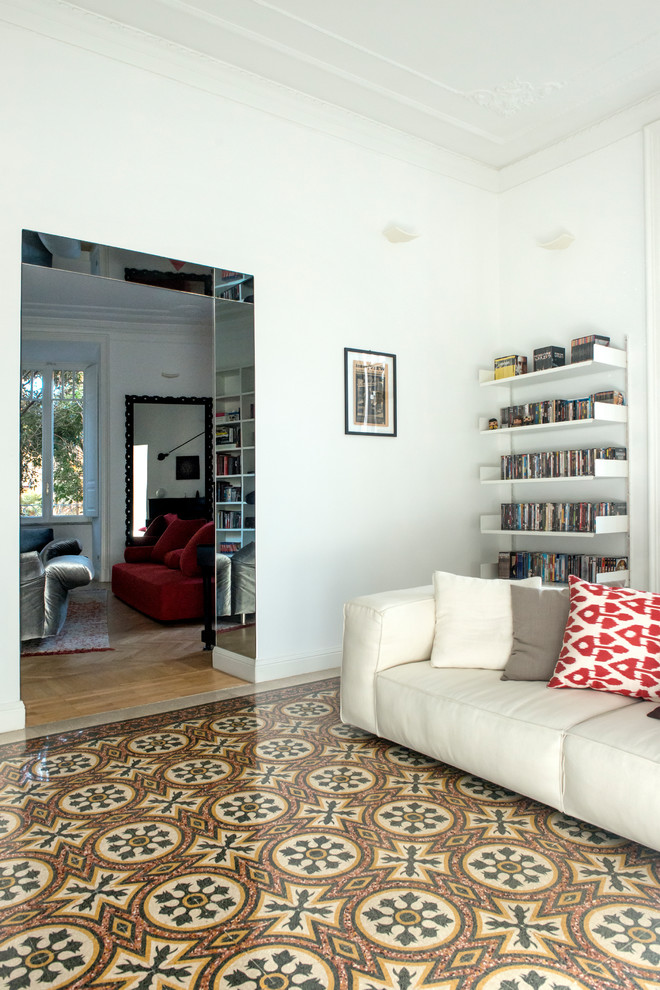 Photo of an expansive contemporary open concept family room in Rome with white walls and marble floors.