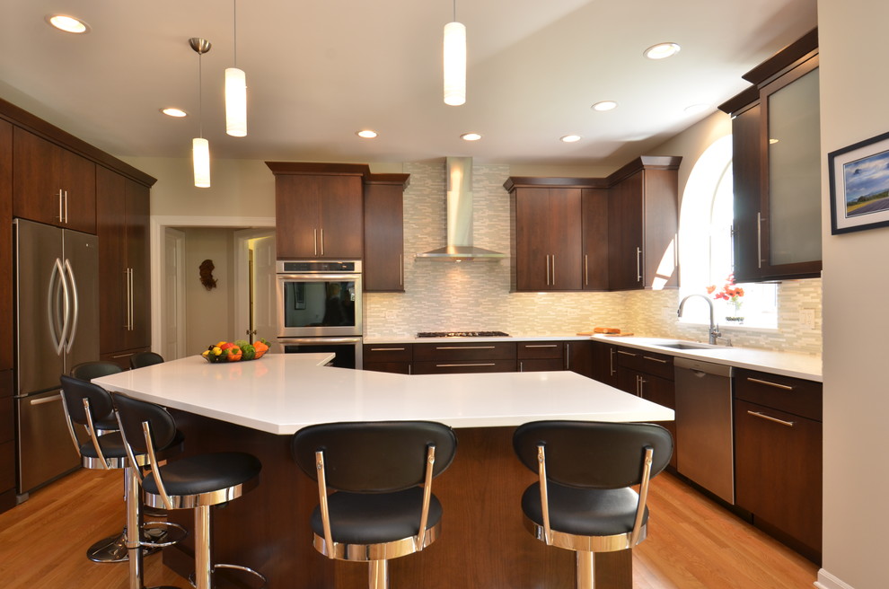 Mid-sized transitional l-shaped light wood floor eat-in kitchen photo in Chicago with an undermount sink, flat-panel cabinets, dark wood cabinets, quartzite countertops, multicolored backsplash, matchstick tile backsplash, stainless steel appliances and an island