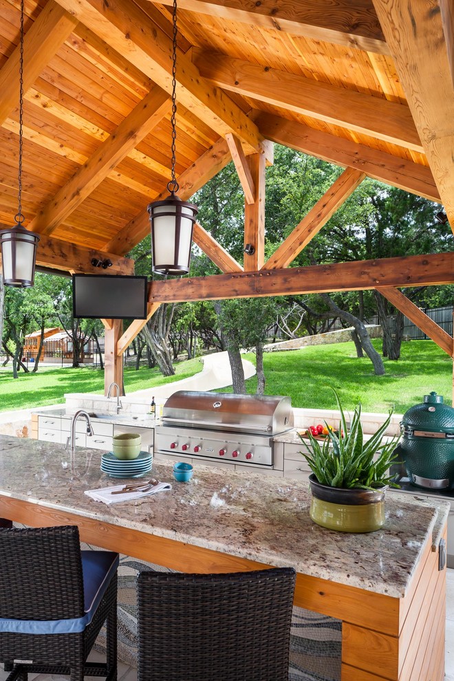 Design ideas for an expansive transitional backyard deck in Austin with a container garden and a pergola.