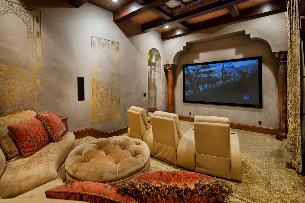 Inspiration for a mediterranean enclosed home theatre in Austin with a projector screen.
