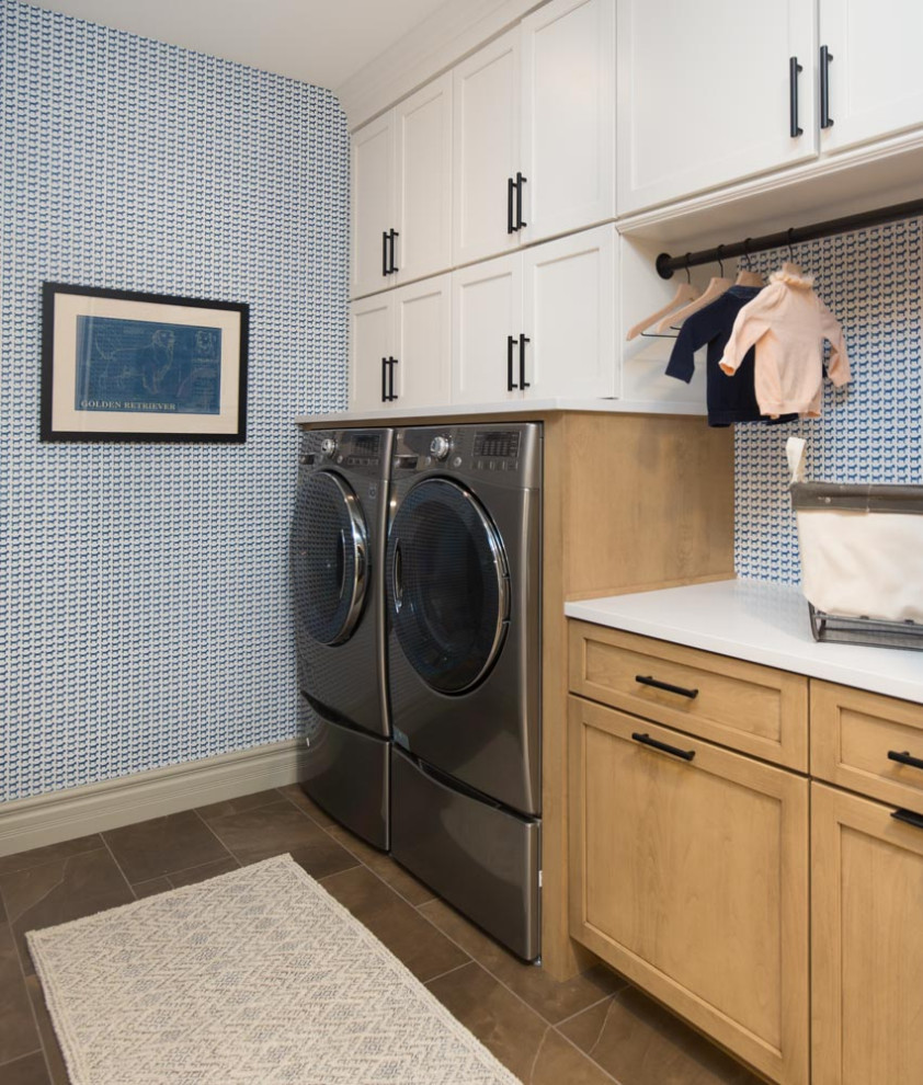 Inspiration for a mid-sized modern l-shaped laundry room in St Louis with an undermount sink, flat-panel cabinets, light wood cabinets, quartzite benchtops, beige splashback, ceramic splashback, medium hardwood floors, brown floor and grey benchtop.