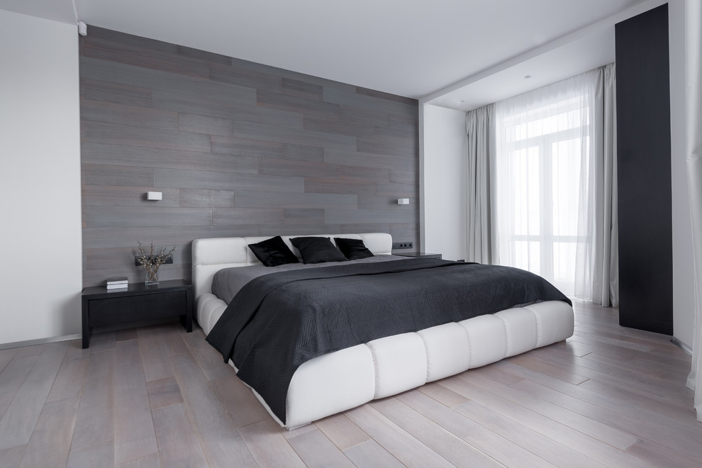 Inspiration for a contemporary master bedroom in Other with grey walls and light hardwood floors.