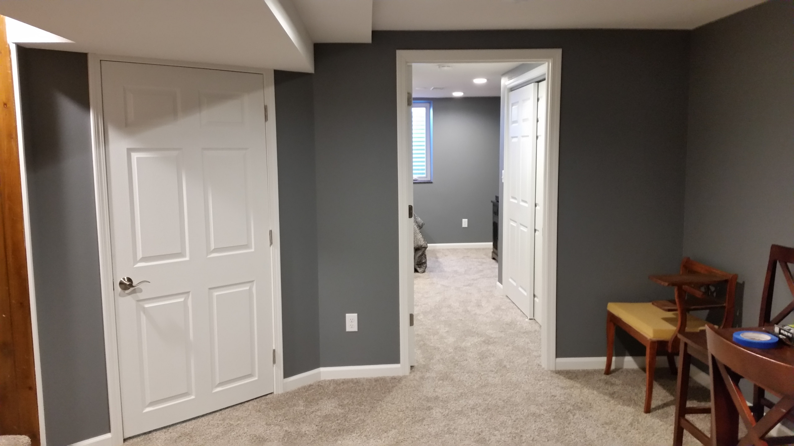 Basement rec room with custom bar and bedroom