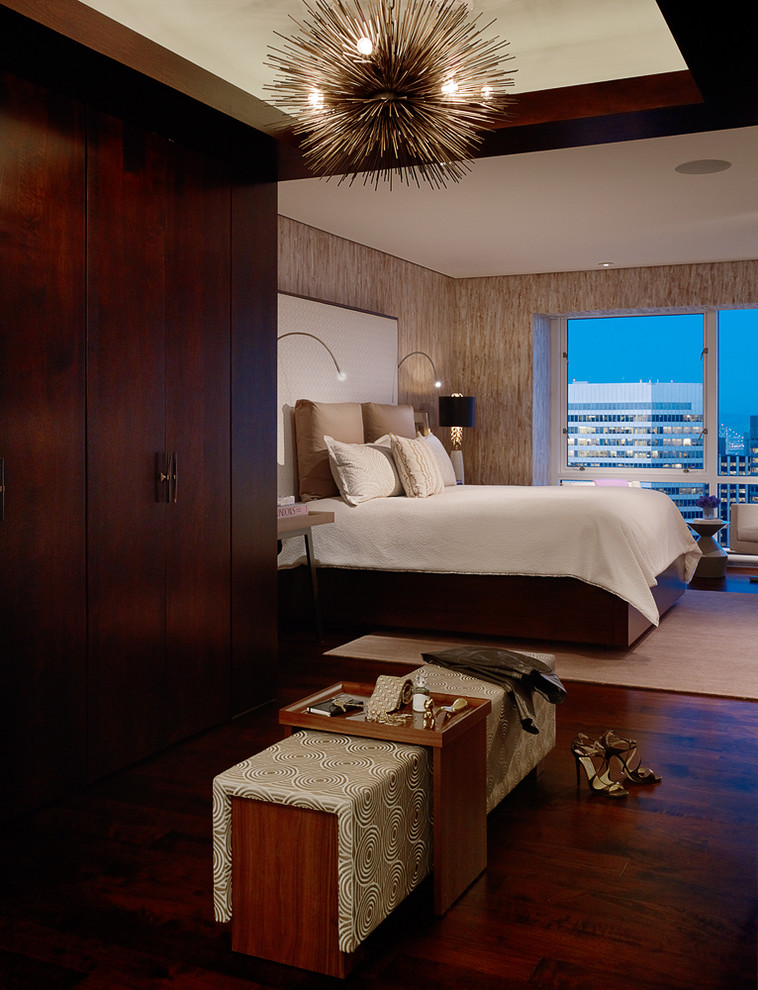 Photo of a contemporary master bedroom in San Francisco with dark hardwood floors.
