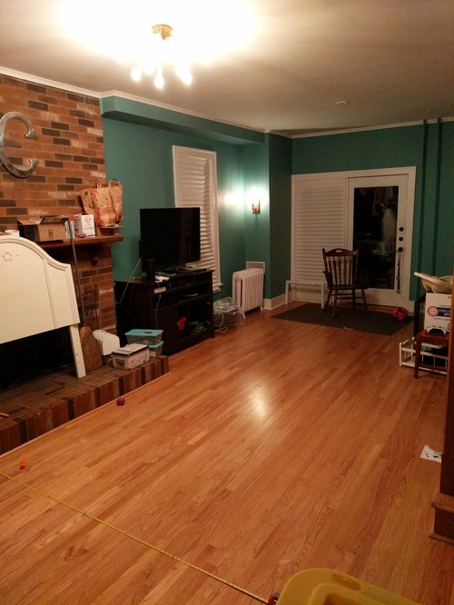 Long very  narrow  living  room  with fireplace staircase