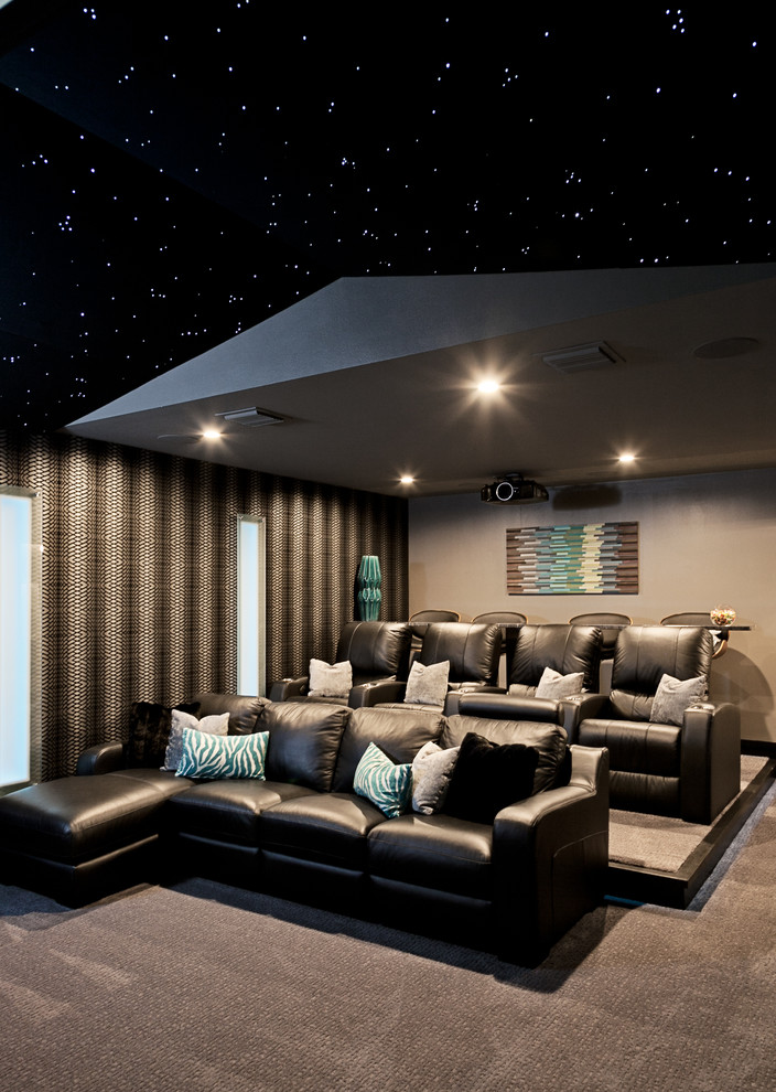 Design ideas for a large contemporary enclosed home theatre in Other with carpet, a projector screen, beige floor and grey walls.