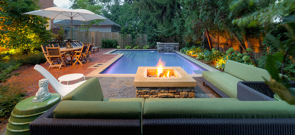 Inspiration for a mid-sized transitional backyard brick and l-shaped natural hot tub remodel in Toronto