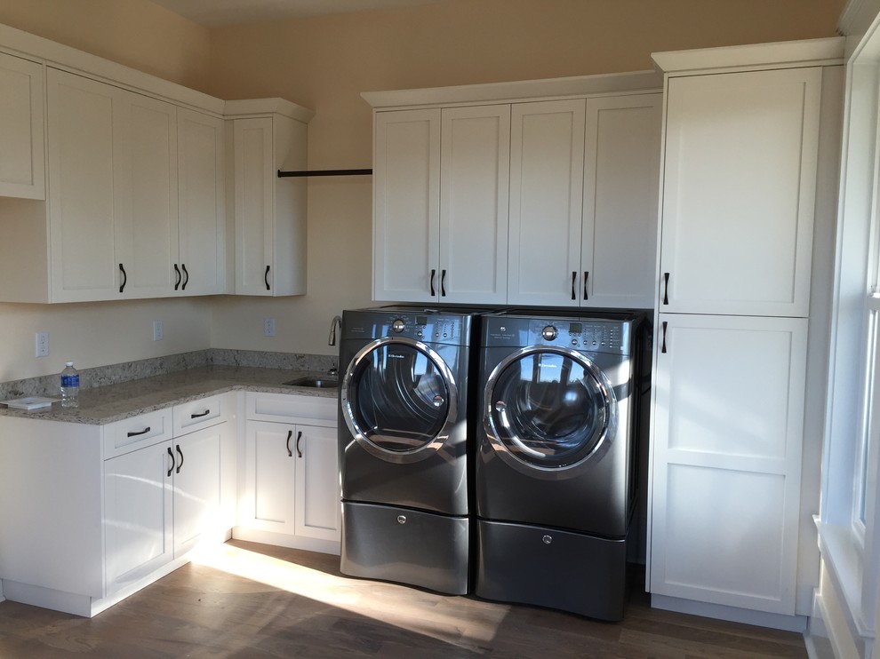 Photo of a transitional laundry room in Charleston.
