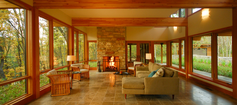 Photo of a contemporary open concept living room in Minneapolis with a stone fireplace surround and no tv.